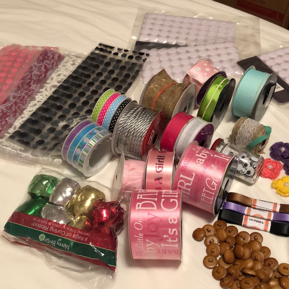Arts and crafts supplies.Ribbons,buttons,curling ribbons,pencils,googly eyes
